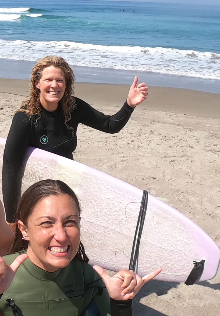 Tarrah and her friend, Bridget, surfing in La Fonda, Mexico.