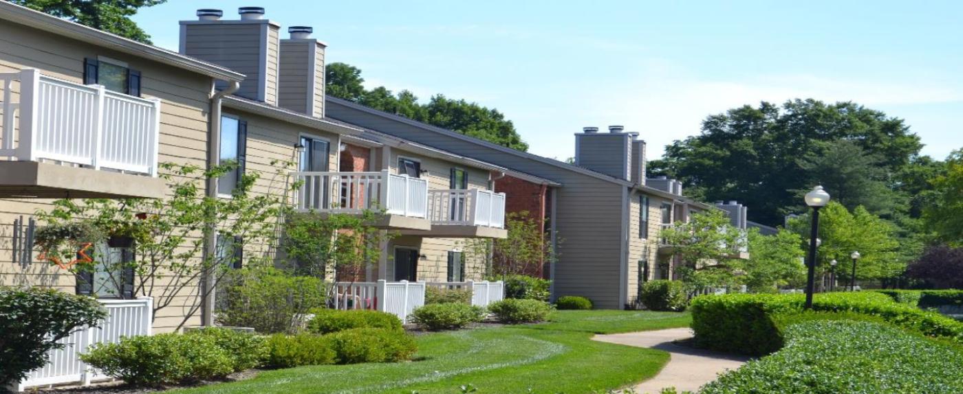 Exterior view of a low-rise, garden style apartment complex