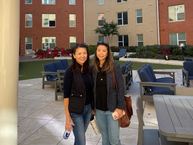 Staff outside apartment building