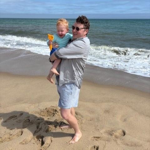 Josh at the beach with his son
