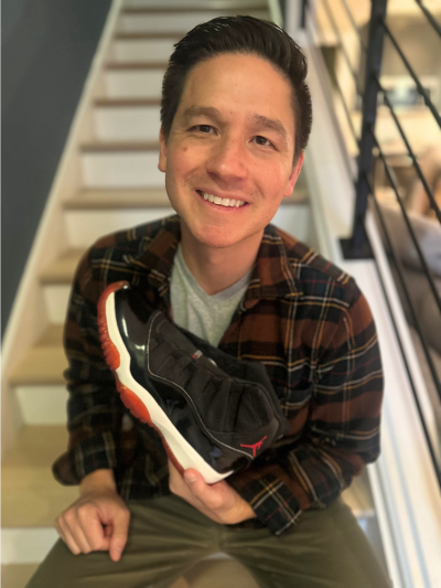 Chris holding his prized Air Jordan XIs.